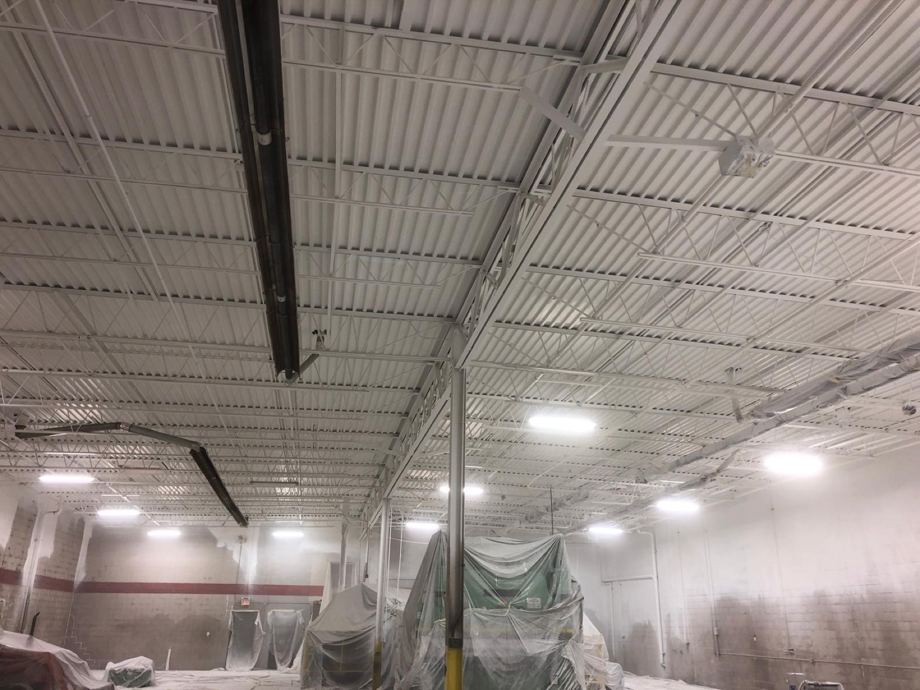Wide industrial facility with coated ceiling and walls