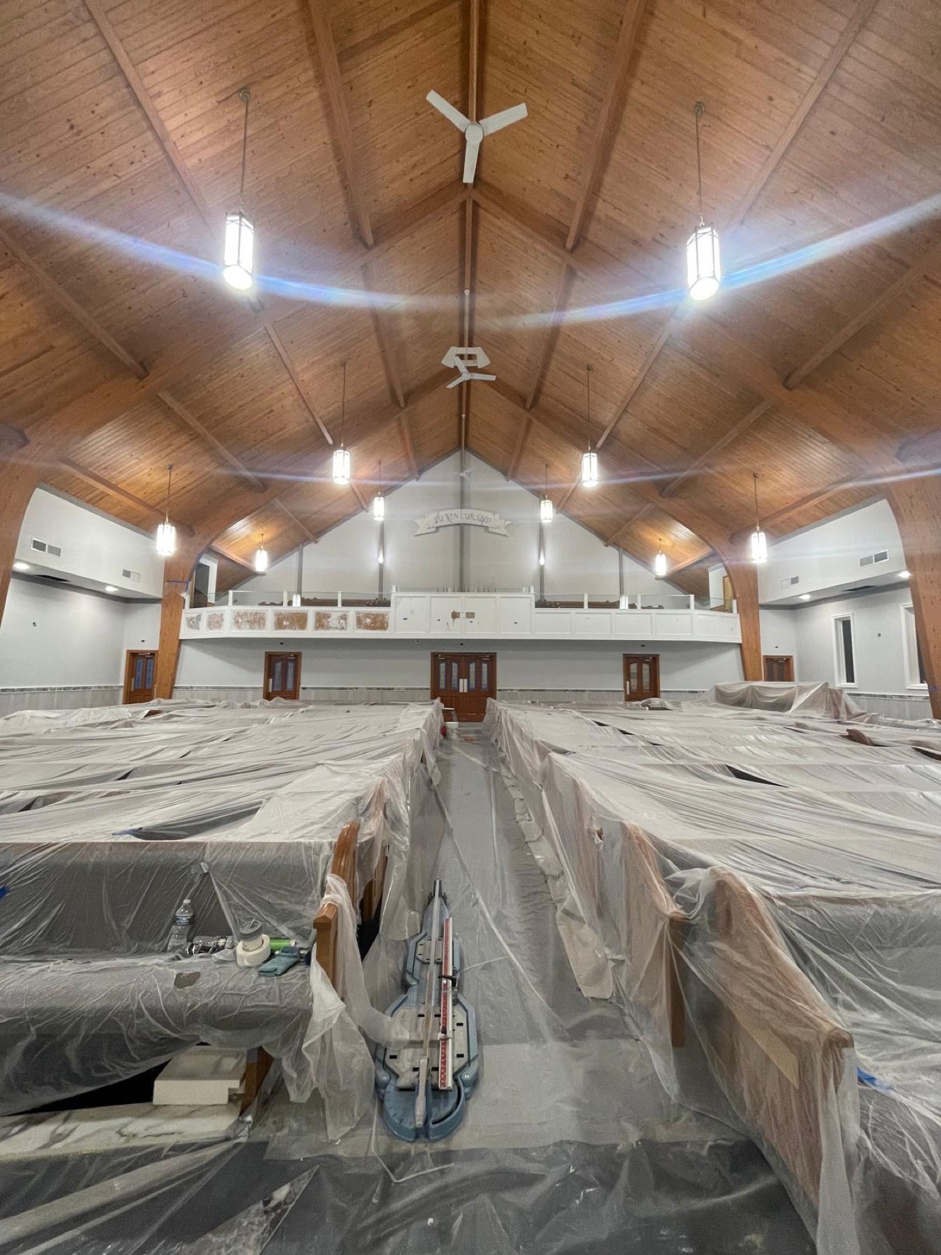 Sanctuary with seating protected and painting work underway